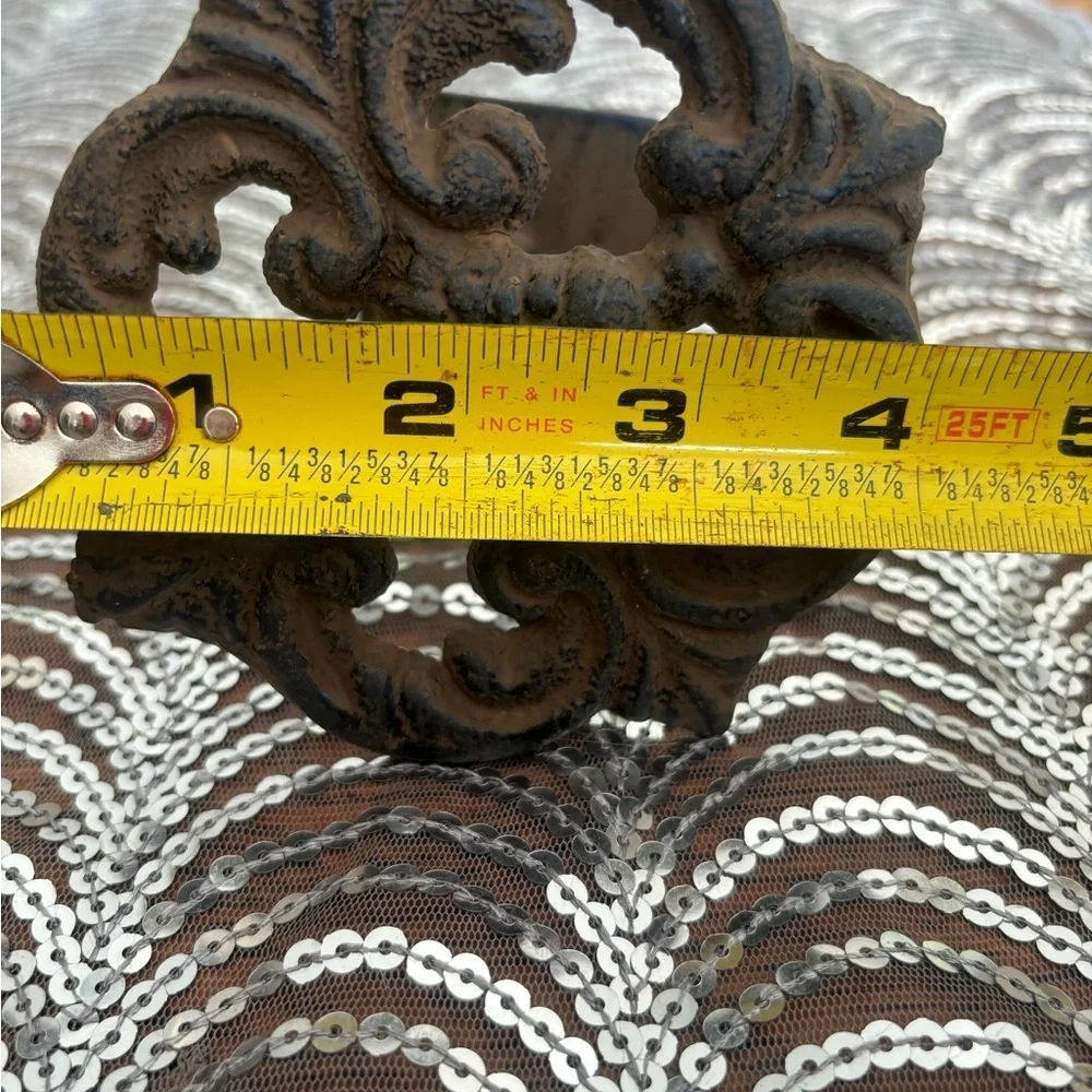 Antique cast iron curtain accents